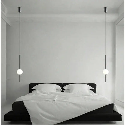 Modern black and gold pendant light with glass shade featuring minimalist spherical globes for living room decorbites gold pendant