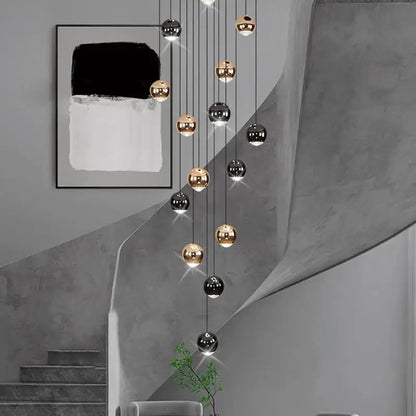 Modern black and gold spherical pendant light made of ironware alloy for staircase featuring polished bulbs in modern interiors