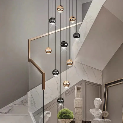Modern black and gold spherical pendant light in ironware alloy hangs elegantly for staircase lighting in modern interiors