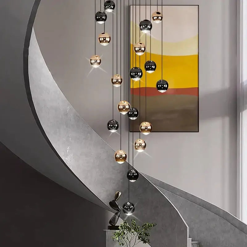 Modern black and gold spherical pendant light made of ironware alloy for staircase in contemporary interiors