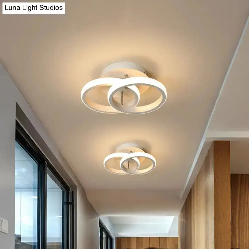 Modern white circular led ceiling lamp with intersecting ring design offering exceptional lighting efficiency for corridor use