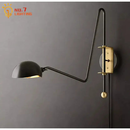 Modern black and gold swing arm wall lamp with black and brass articulated arm and spherical knob for living room decorbites black gold