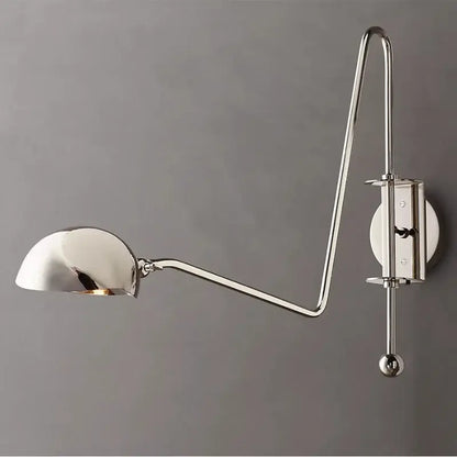 A sleek chrome wall lamp with curved swing arm and adjustable dome shade for modern decorbites black gold living room decor
