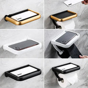 Modern black and gold wall-mounted tissue paper holder with phone tray for bathroom use