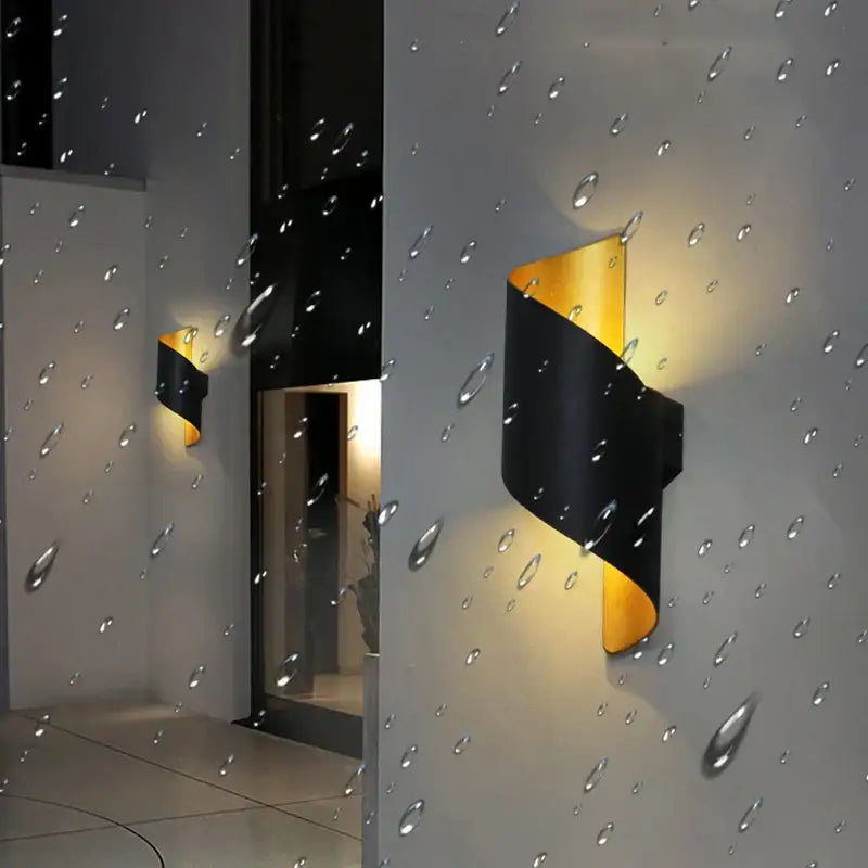 Modern black and gold twisted led wall lamp with sleek design ideal for corridor lighting as a stylish led wall sconce