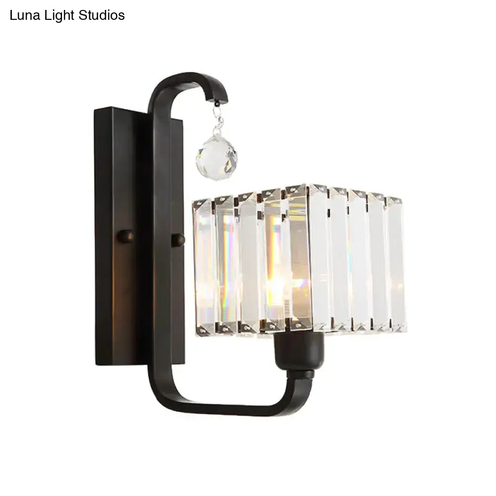 Modern black metal wall sconce with rectangular crystal shade and faceted crystal accent for living room wall lamp