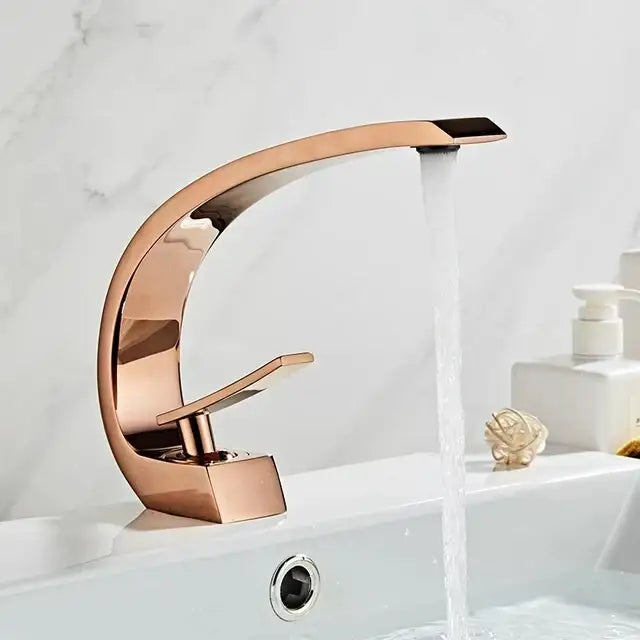 Rose gold modern basin faucet with sleek curved design and polished finish from decorbites black gold collection