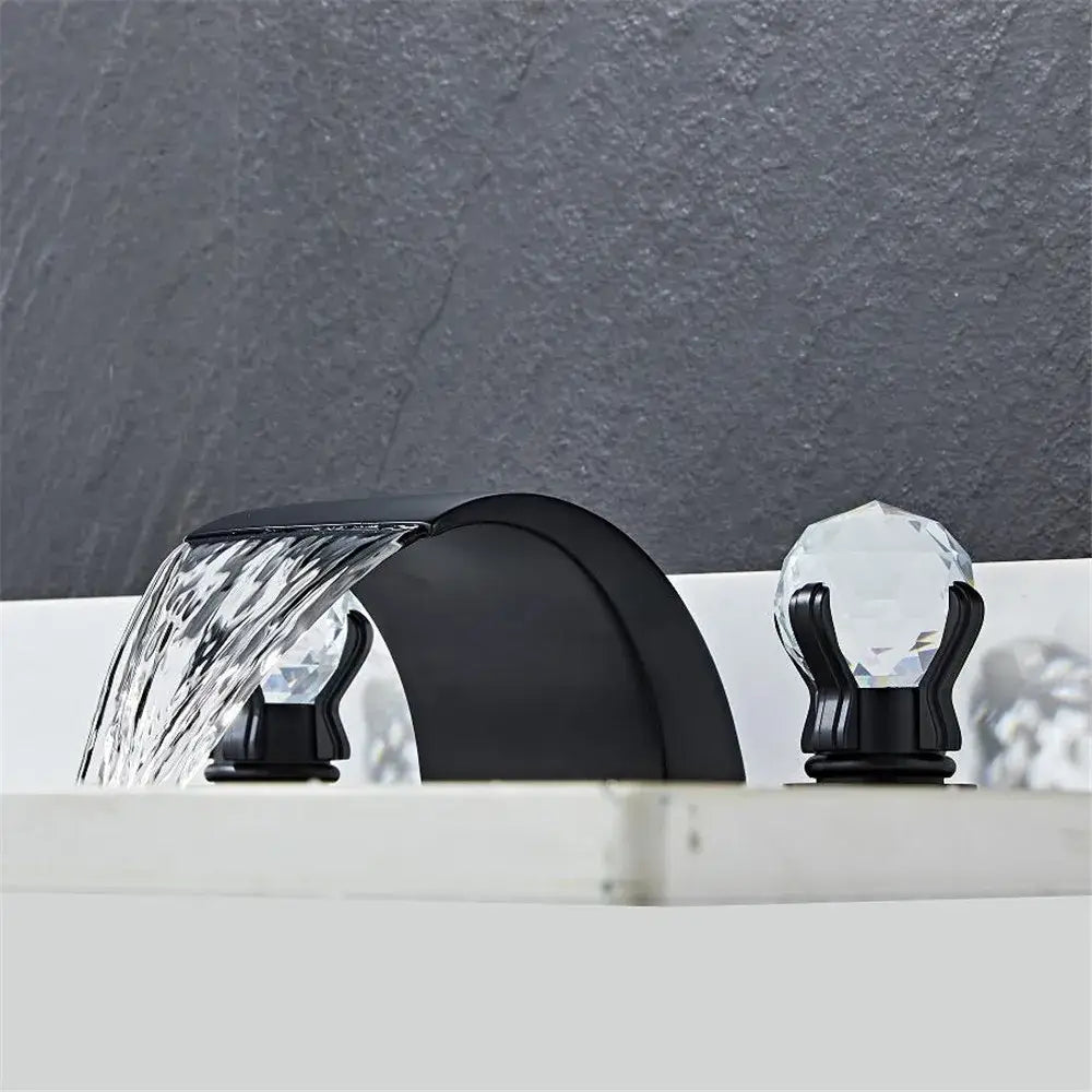 Modern black and gold decorbites black basin faucet with crystal accents and waterfall spout design for bathroom sink