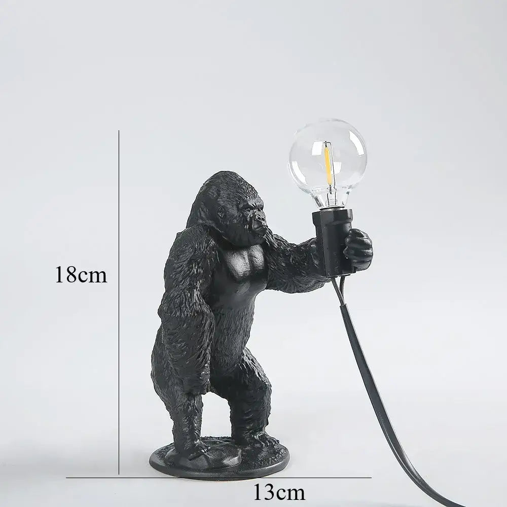 Modern black gorilla night light bedroom resin lamp with textured surface holding clear bulb by decorbites gorilla night