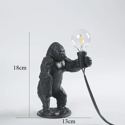 Modern black gorilla night light bedroom resin lamp with textured surface holding clear bulb by decorbites gorilla night