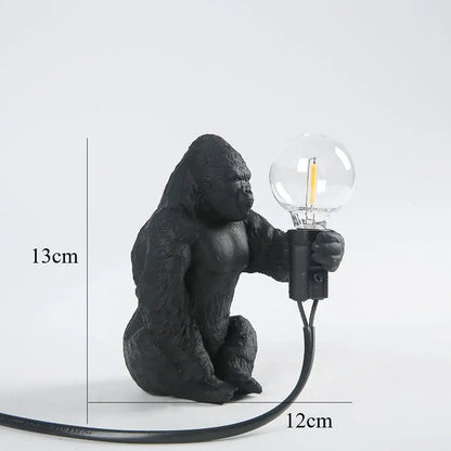 Modern black gorilla night light bedroom resin lamp with textured matte finish holding clear glass bulb decorbites gorilla night