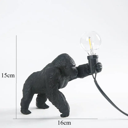 Modern black gorilla night light made of resin with a textured matte finish holding an exposed filament bulb for decorbites gorilla night