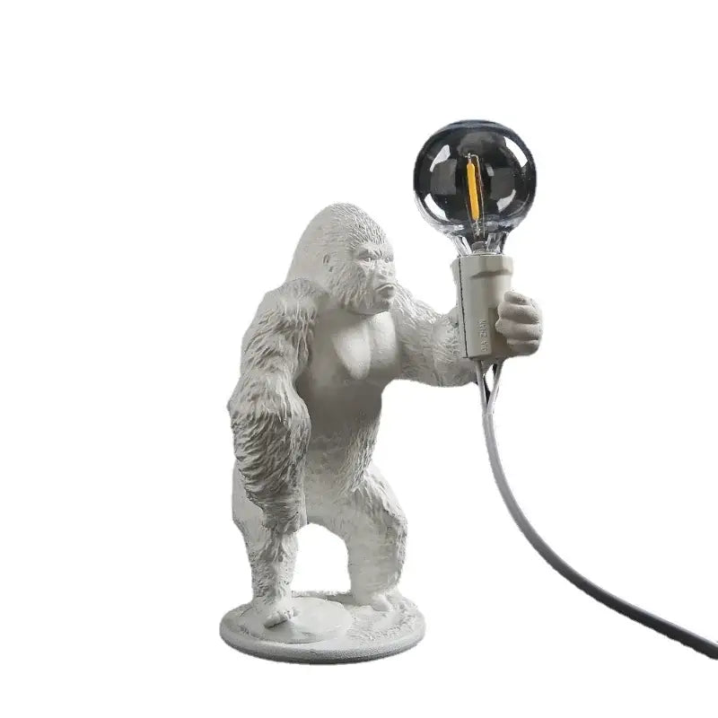 Modern black resin gorilla night light holding a white ceramic spherical filament bulb for bedroom decorbites gorilla night use