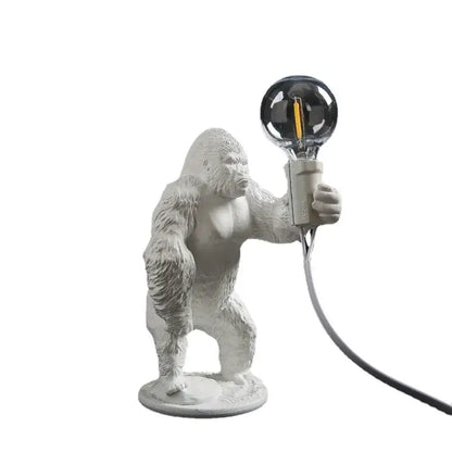 Modern black resin gorilla night light holding a white ceramic spherical filament bulb for bedroom decorbites gorilla night use