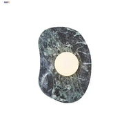 Modern black and green marble wall sconce with circular warm light featuring decorbites green marble stone design