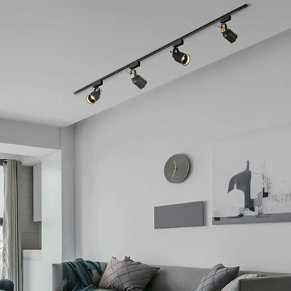Modern black gu10 7w led track lights with adjustable spotlights on a sleek ceiling rail ideal for kitchen display
