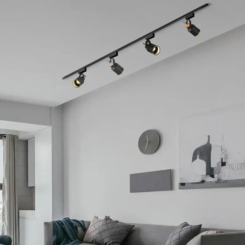 Modern black gu10 7w led track lights with adjustable spotlights on a sleek ceiling rail ideal for kitchen display