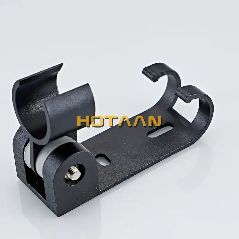 Modern black hand shower holder wall mount bracket with hooks featuring a black plastic and metal roller mechanism