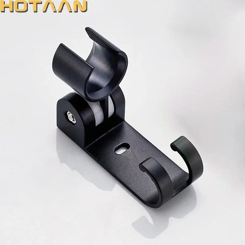 Modern black plastic hand shower holder with curved hook and adjustable wall mount bracket for bathroom organization