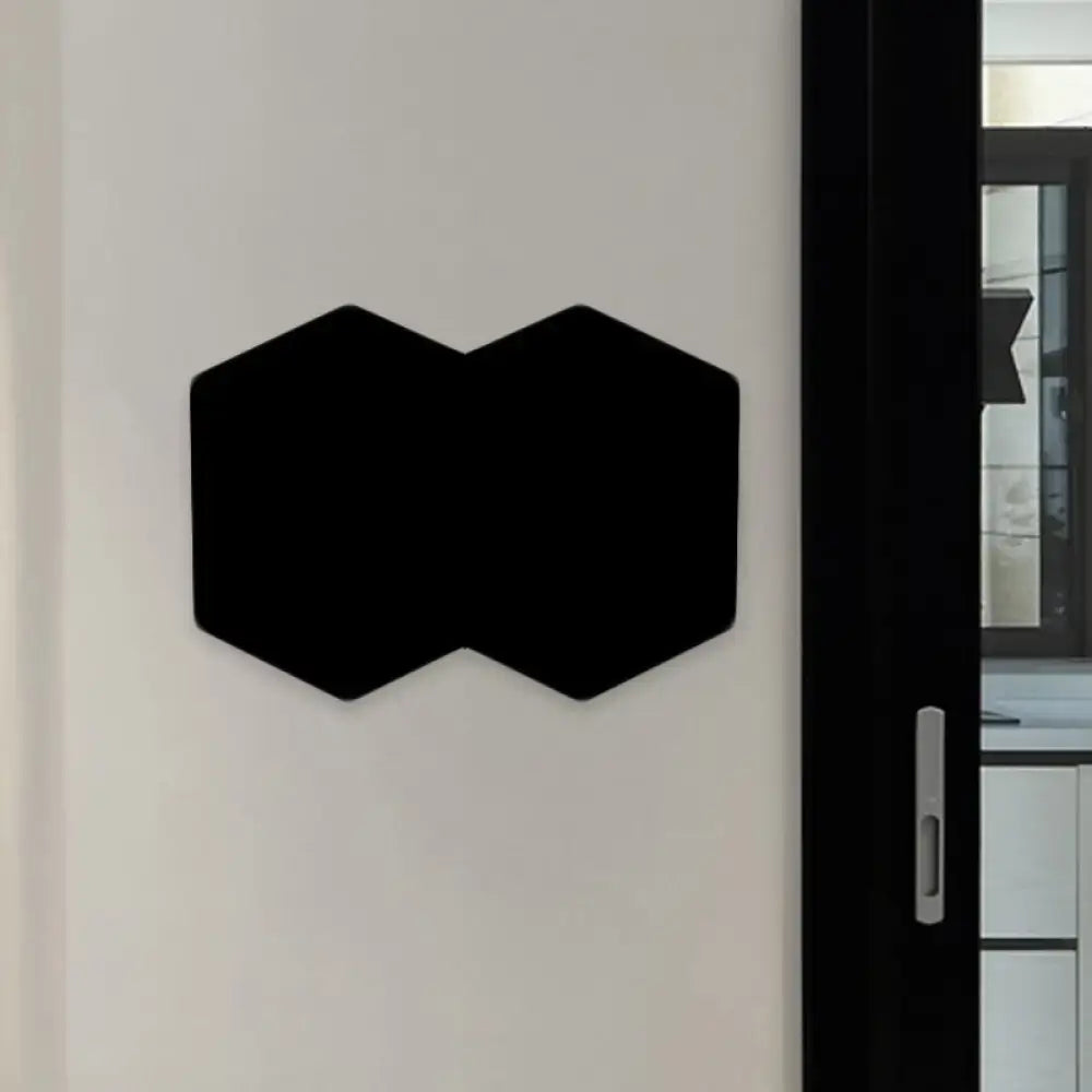 Modern black hexagon wall mount light with aluminum shade for bedroom decor mounted on a black magnetic board
