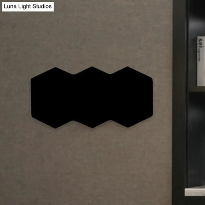 Black hexagonal wall mount light with aluminum shade for modern bedroom decor and acoustic paneling
