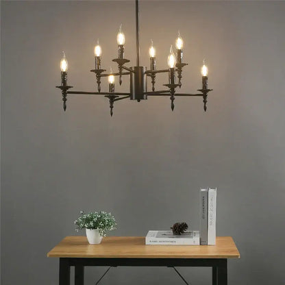 Modern black iron art led pendant chandelier featuring industrial-style black metal with multiple lit candle-like bulbs for living room decor