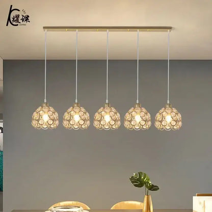 Modern black iron cage pendant lamp with gold-toned crystal dining pendant lights for kitchen island decorbites lighting