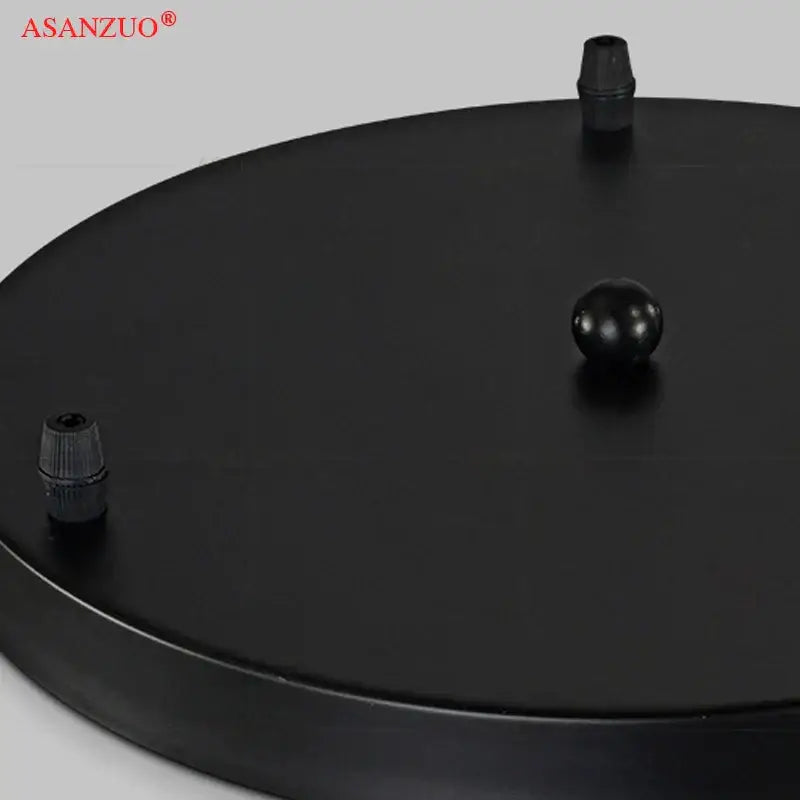 Black circular iron chassis ceiling panel with two caps and central knob for modern dining room decorbites iron chassis light