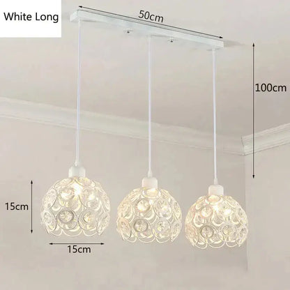 White three-light pendant lamp with crystal-encrusted spherical shades and rectangular ceiling mount for dining room decorbites crystal triple pendant
