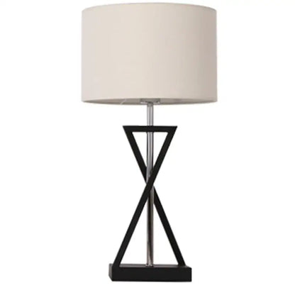 Modern black iron table lamp with cream fabric shade and geometric base ideal for bedroom decorbites iron table design