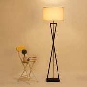 Modern black iron table lamp with cylindrical off-white fabric shade for bedroom by decorbites iron table decor