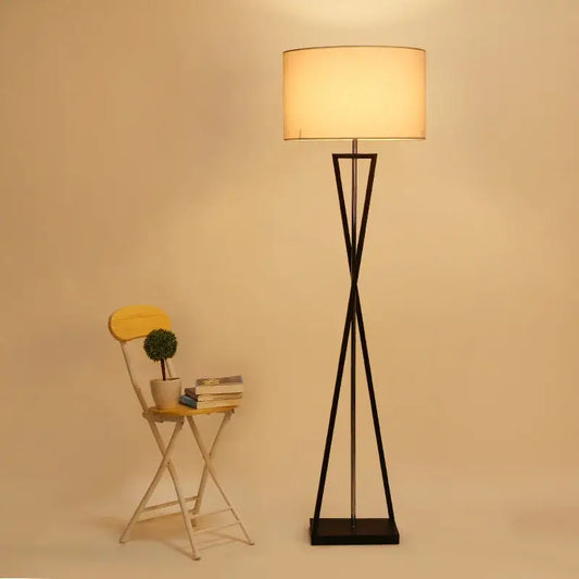 Modern black iron table lamp with cylindrical off-white fabric shade for bedroom by decorbites iron table decor
