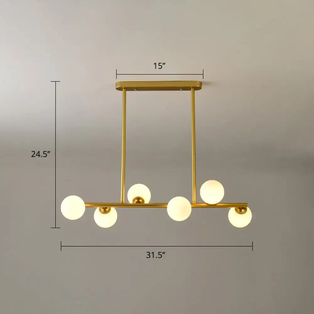 Gold-toned modern modo island ceiling pendant light with six frosted glass globe bulbs for dining room lighting