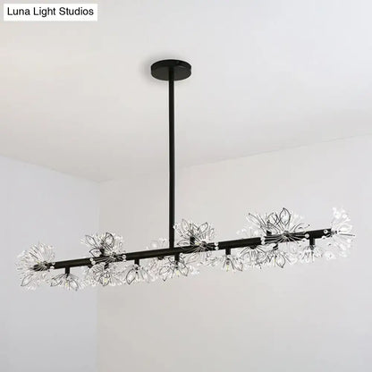 Modern black island pendant light featuring clear crystal flower fixtures for elegant dining room decor