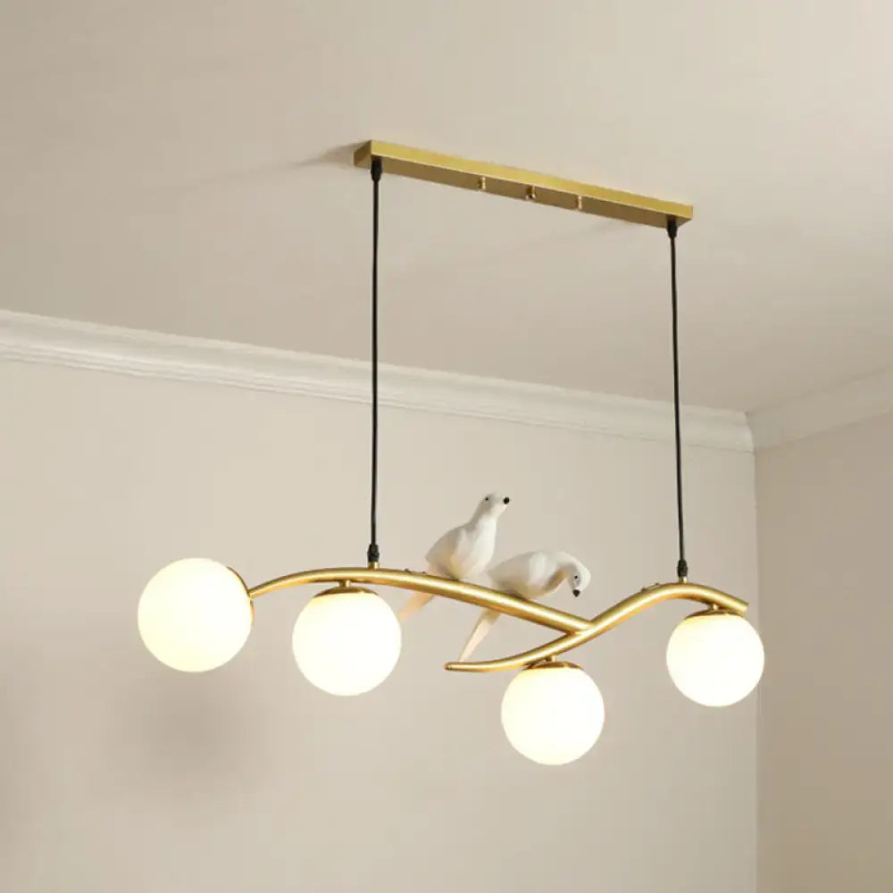 Decorbites™ modern gold-toned island pendant light with frosted glass bulbs and white ceramic dove figurines for dining room