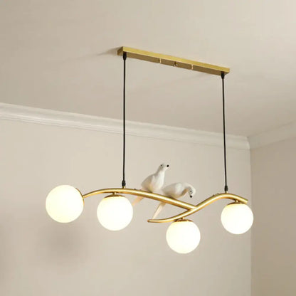 Decorbites™ modern gold-toned island pendant light with frosted glass bulbs and white ceramic dove figurines for dining room