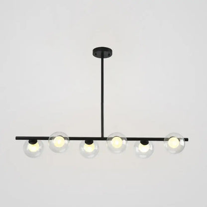 Modern black island pendant with clear glass globes featuring five black gold globe bulbs for dining room lighting