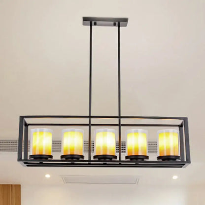 Black metal island pendant with five warm yellow glass candle-style bulbs and white glass accents for kitchen lighting