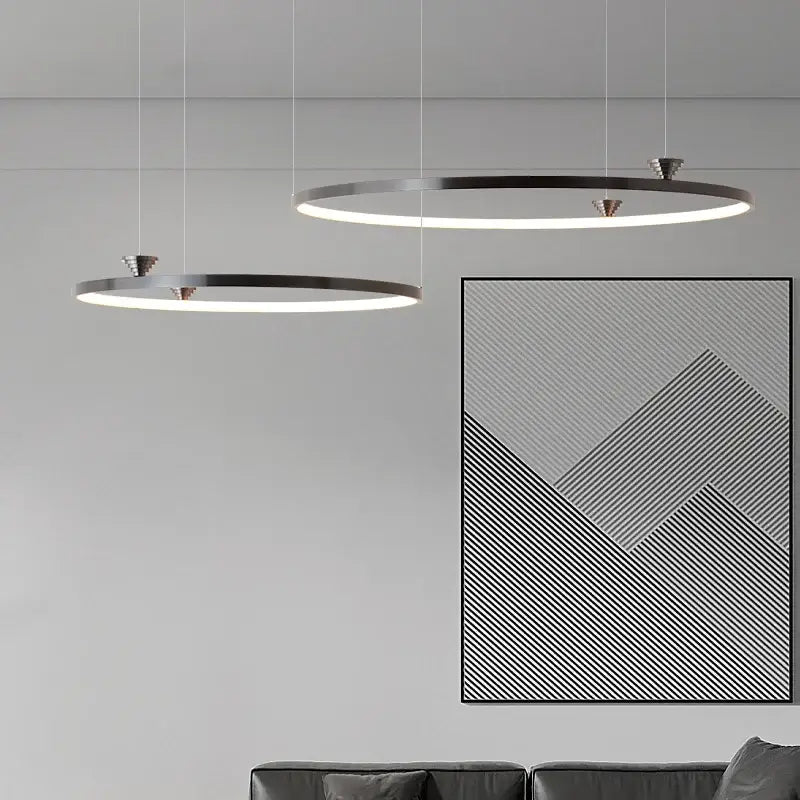 Modern black italian style led pendant light with circular illuminated rings and sleek metallic frames for living room