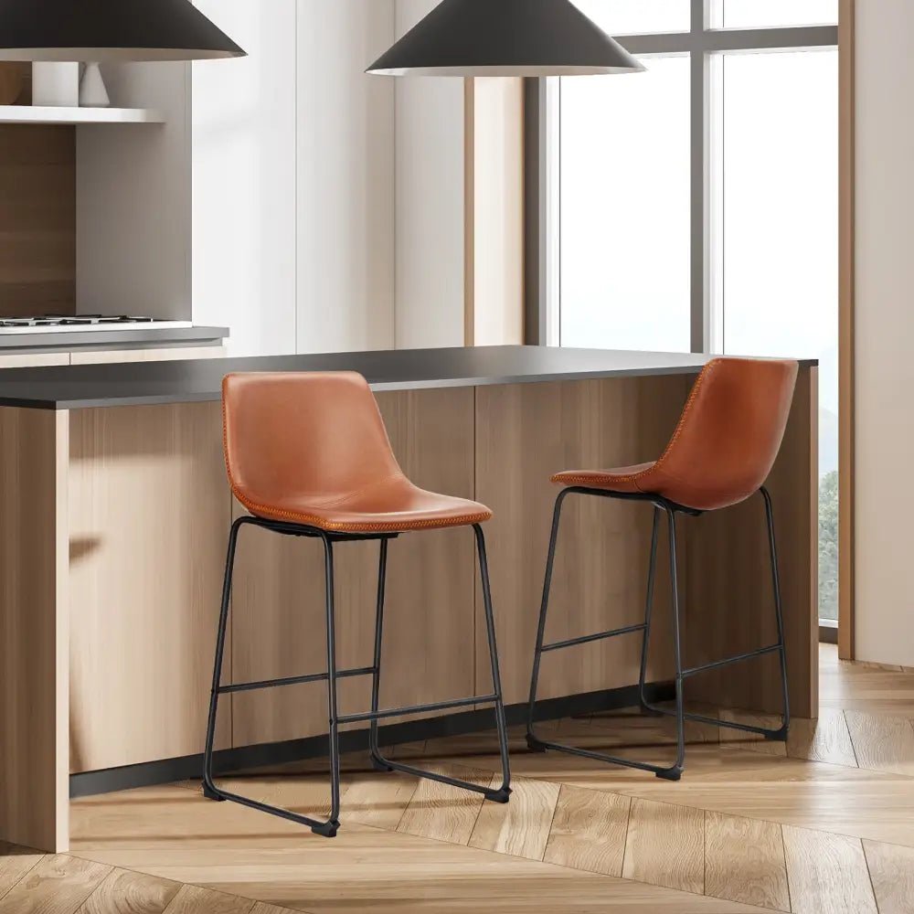 Modern black leather bar stools with gold stitching for kitchen island - Decorbites
