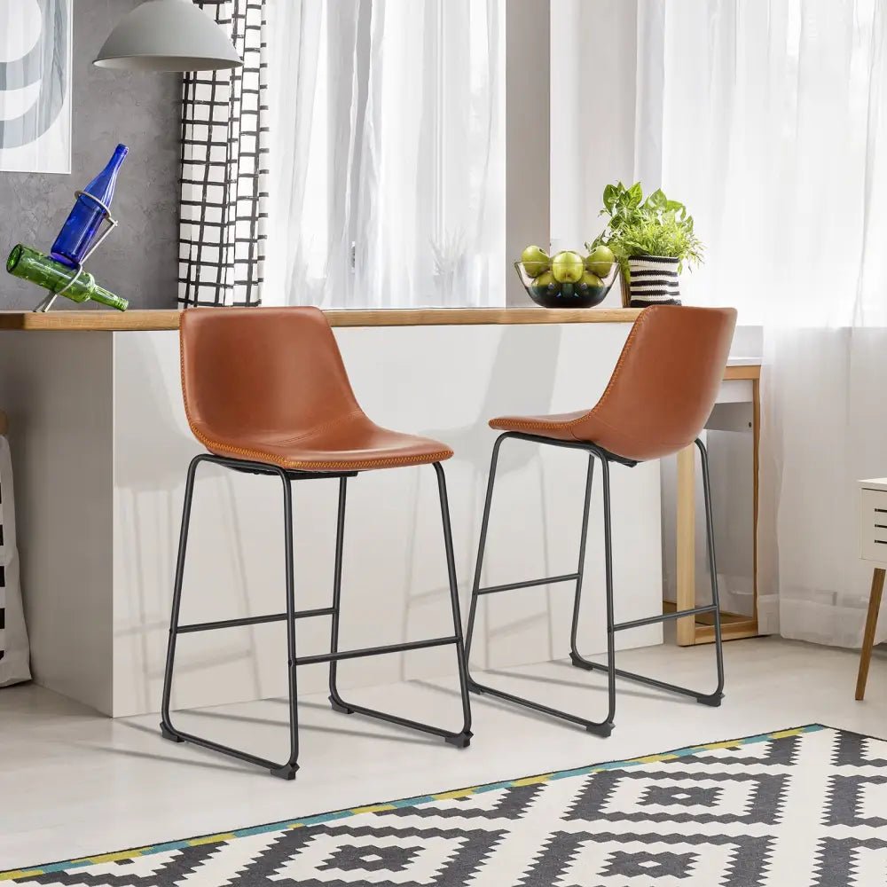 Modern black leather bar stools with gold stitching for kitchen island - Decorbites