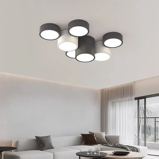 Modern black led ceiling lamp featuring a cylindrical design with multiple circular bulbs ideal for living rooms