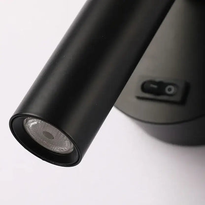Modern black led wall lamps featuring an adjustable cylindrical spotlight with matte finish and visible reflector for reading