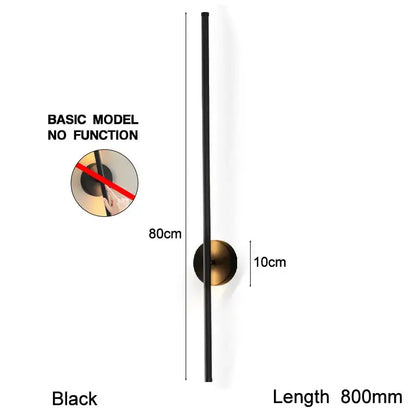 Modern black led wall sconce with a sleek cylindrical design and antique brass base for bedroom lighting