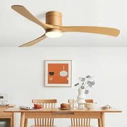Modern black ceiling fan with light wood finish, three blades, central light fixture, and remote control for bedroom use