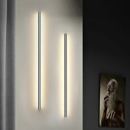 Two modern black decorbites led wall lights with minimalist linear design emit warm light with wall lights dimming feature