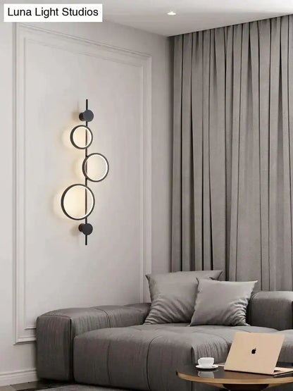 Modern black linear long led wall light featuring a Nordic linear long design with three illuminated circular rings