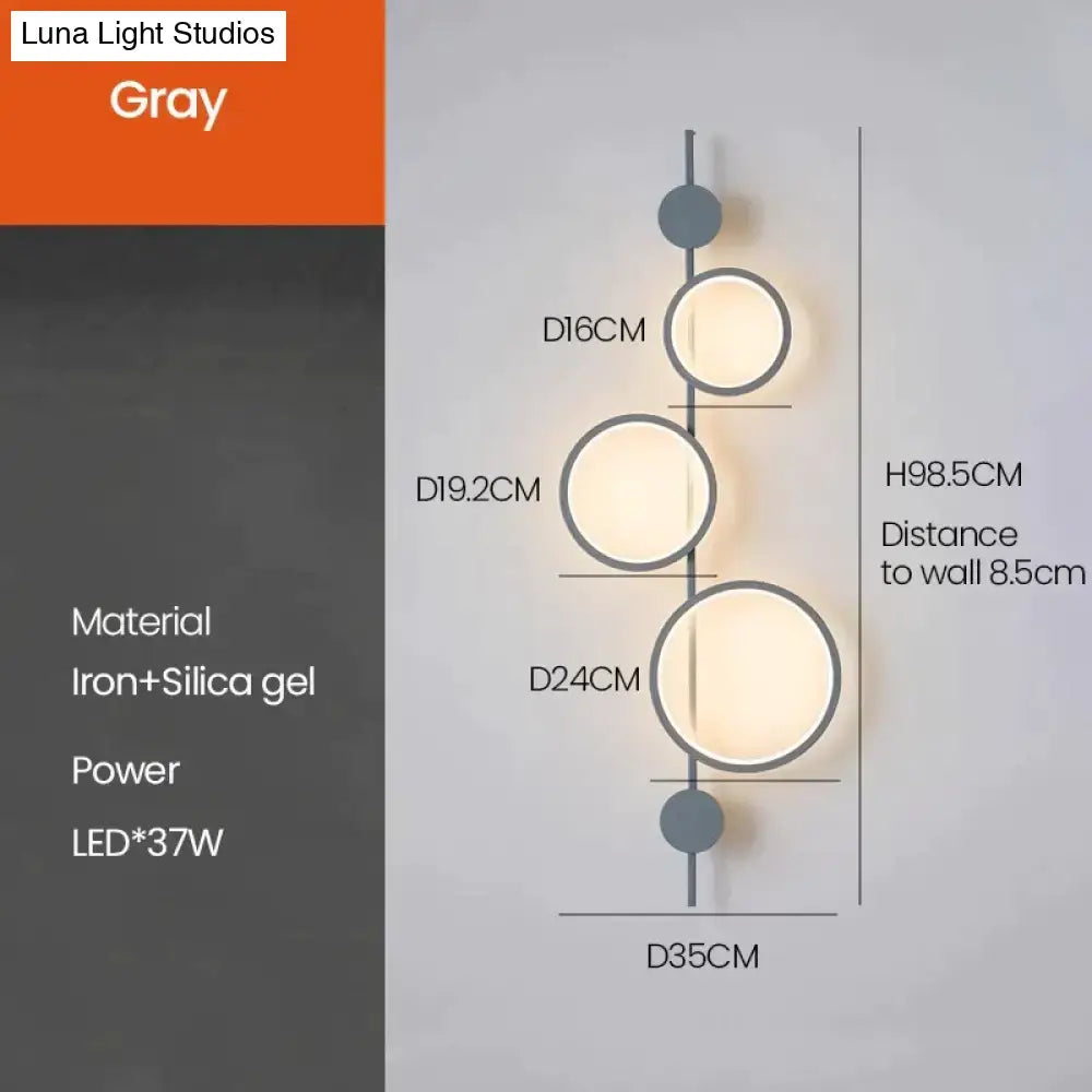 Modern black linear long led wall light with gray minimalist iron frame and three circular led lights for living room use