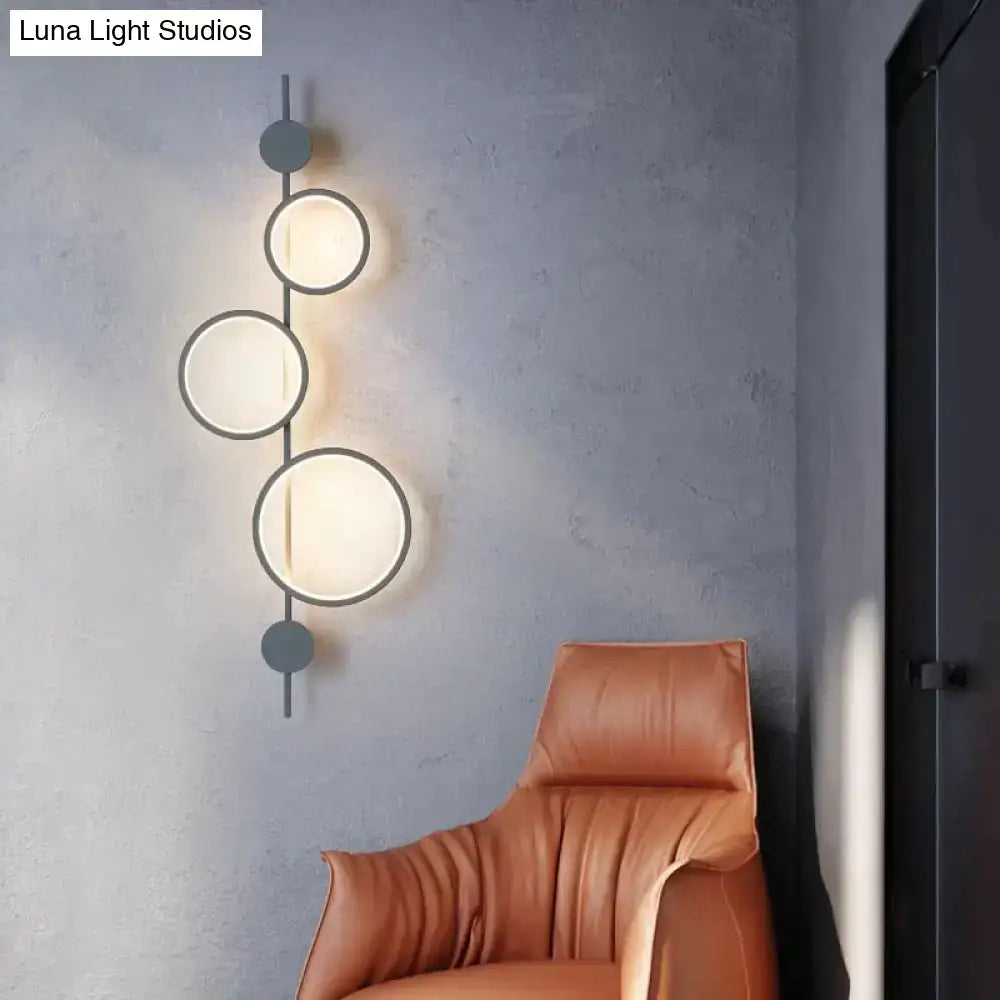 Modern black metal nordic linear long led wall light with three illuminated circular shades for living room sconce