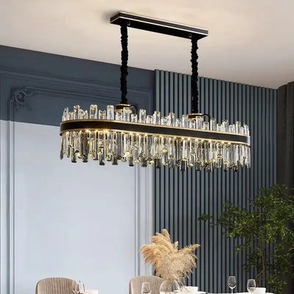 Elegant black and gold oval luxury crystal chandelier with cascading clear prisms for dining room decorbites light luxury